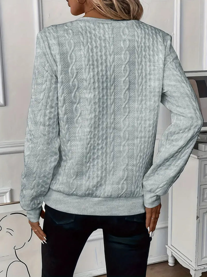 Textured long-sleeve women's half-zip jumper, ring pull, ribbed hem; a casual pullover style.