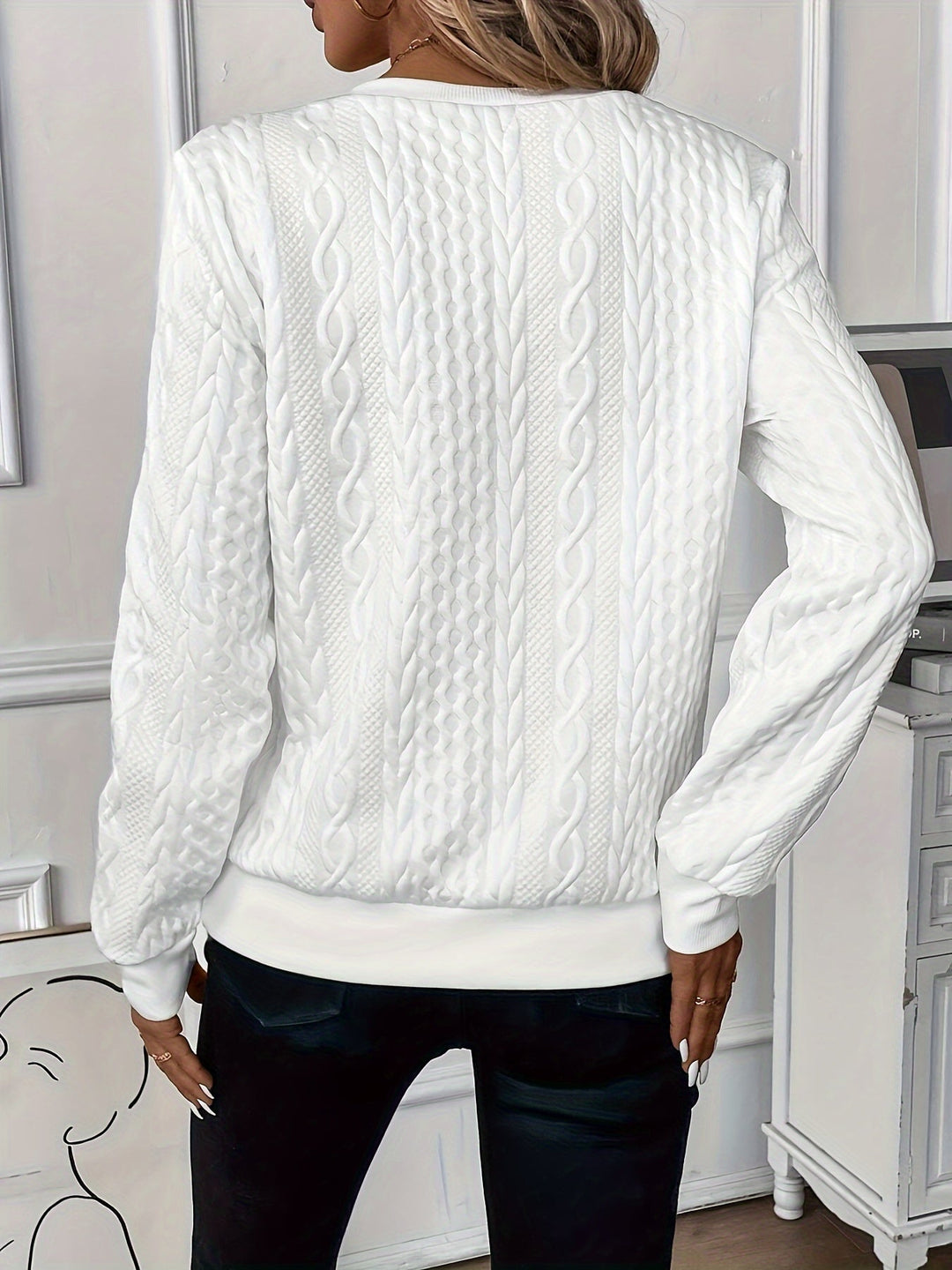 Women's pullover sweater, half-zip design with ring pull, and ribbed hem for a comfortable fit.