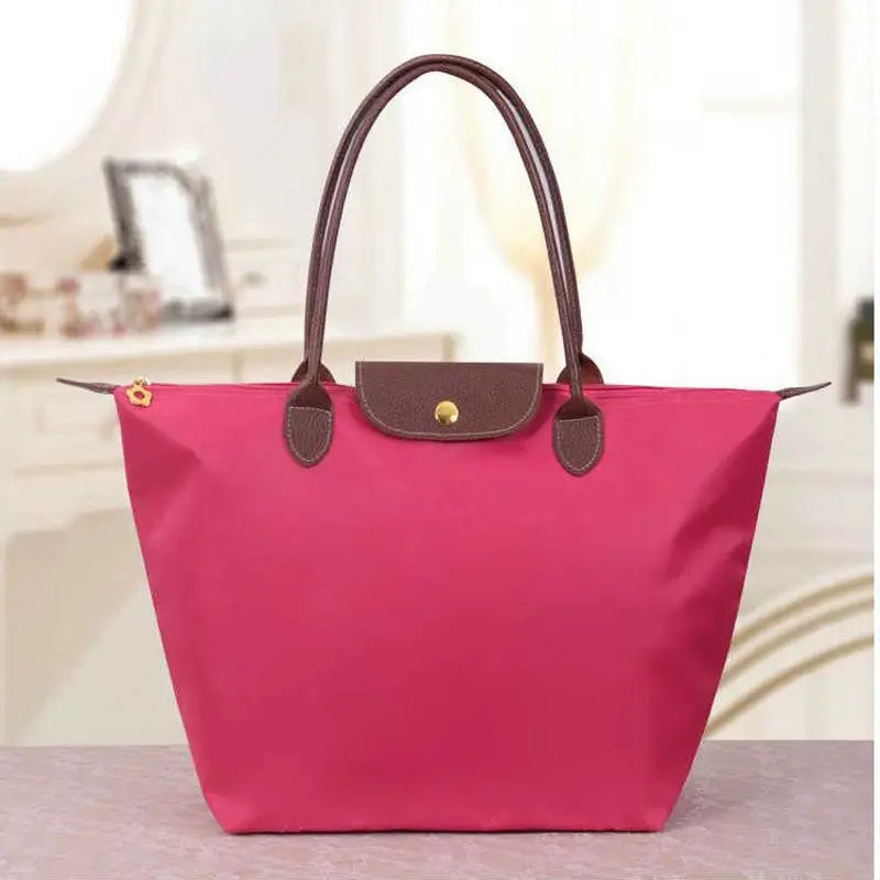 Designer-inspired women's fashion bag, a chic statement accessory for modern women.