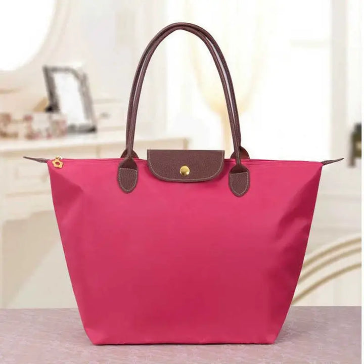 Designer-inspired women's fashion bag, a chic statement accessory for modern women.