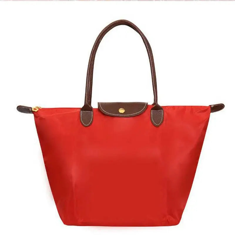 Women's versatile black handbag, a timeless accessory for work, travel, or leisure.