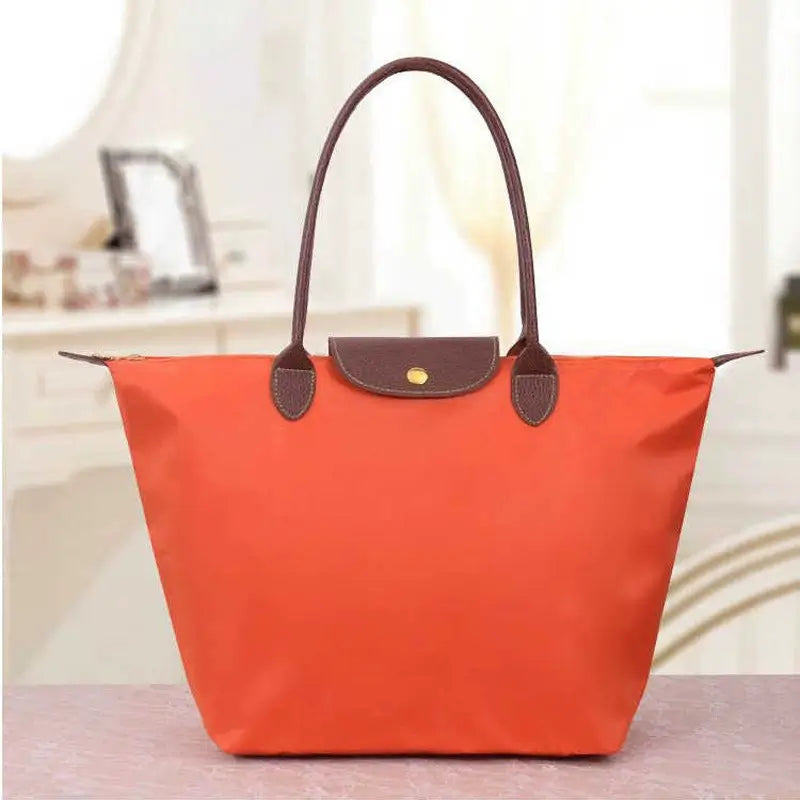 Classic women's handbag, sophisticated design, perfect for work or casual elegance.