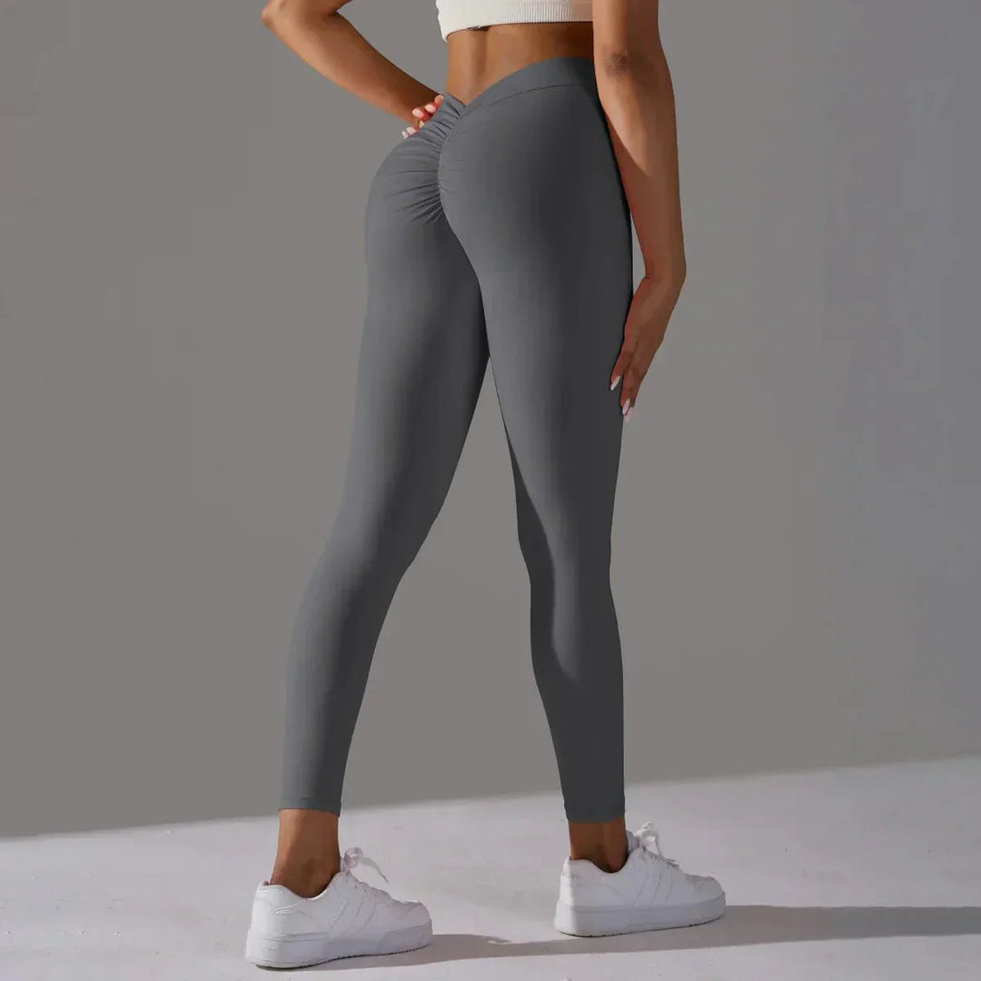 Detail of the high waistband on women's activewear yoga leggings for secure support