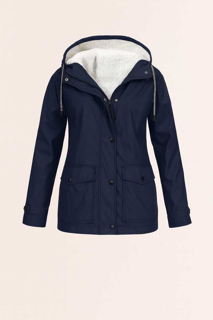 Model wearing a comfortable mid-length women's utility jacket in a casual outdoor setting.