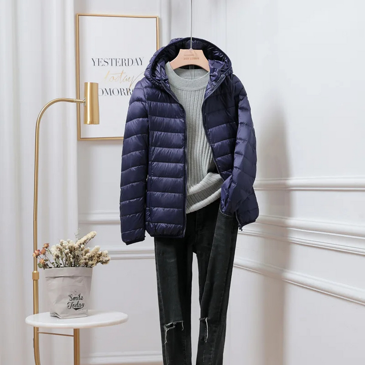 Warm and fashionable womens puffer jacket with a full zip closure