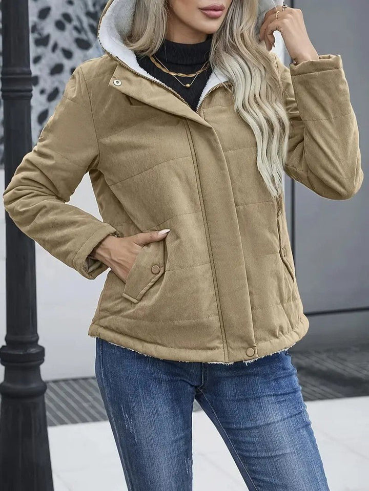 Front view of a women's zip-up jacket, essential cold weather gear.