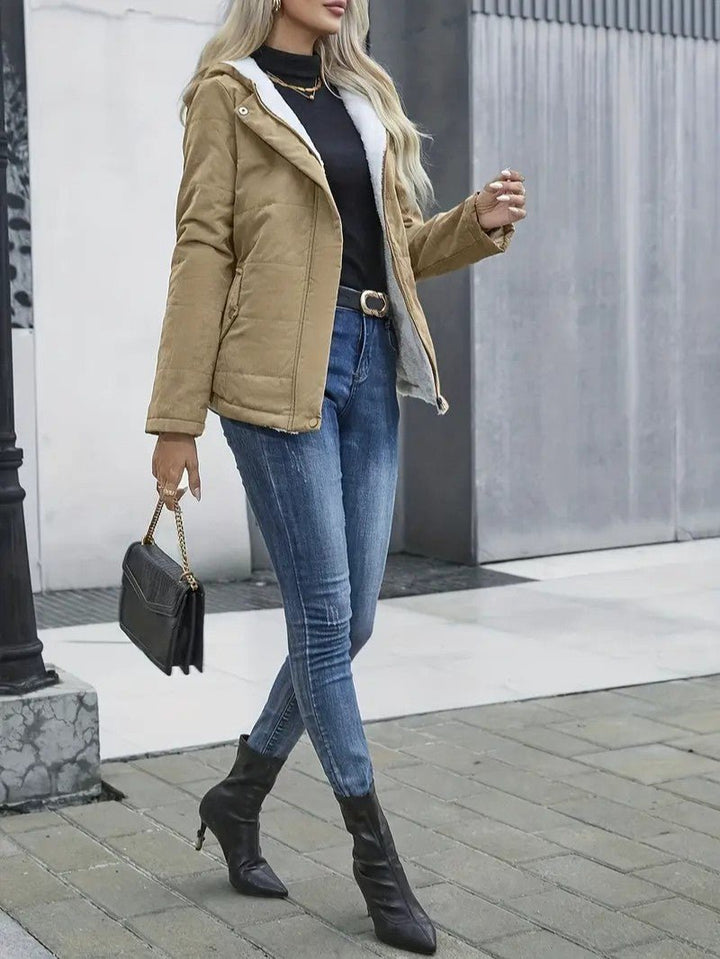 Model showing the versatility of a women's lined zip-up jacket for outdoor activities.