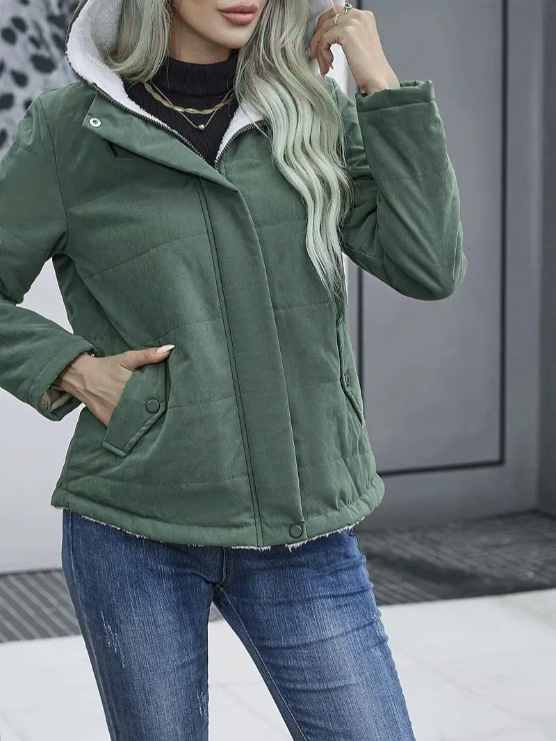 Robust women's cold weather gear: a hooded, zip-up winter jacket.