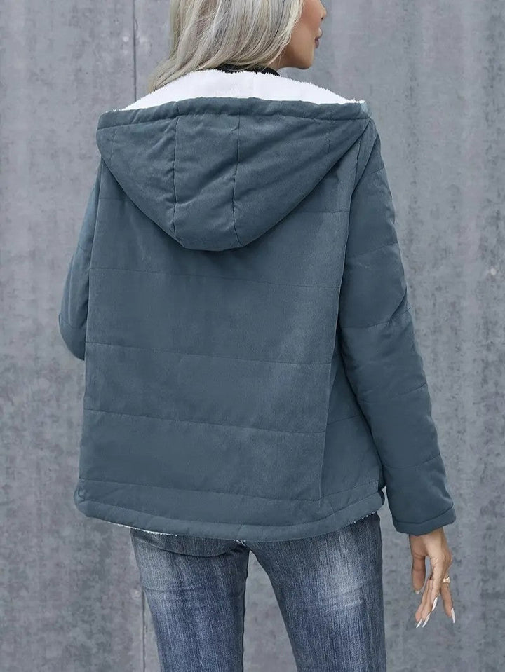 Stylish women's casual outerwear: a warm, hooded zip-up jacket for fall.