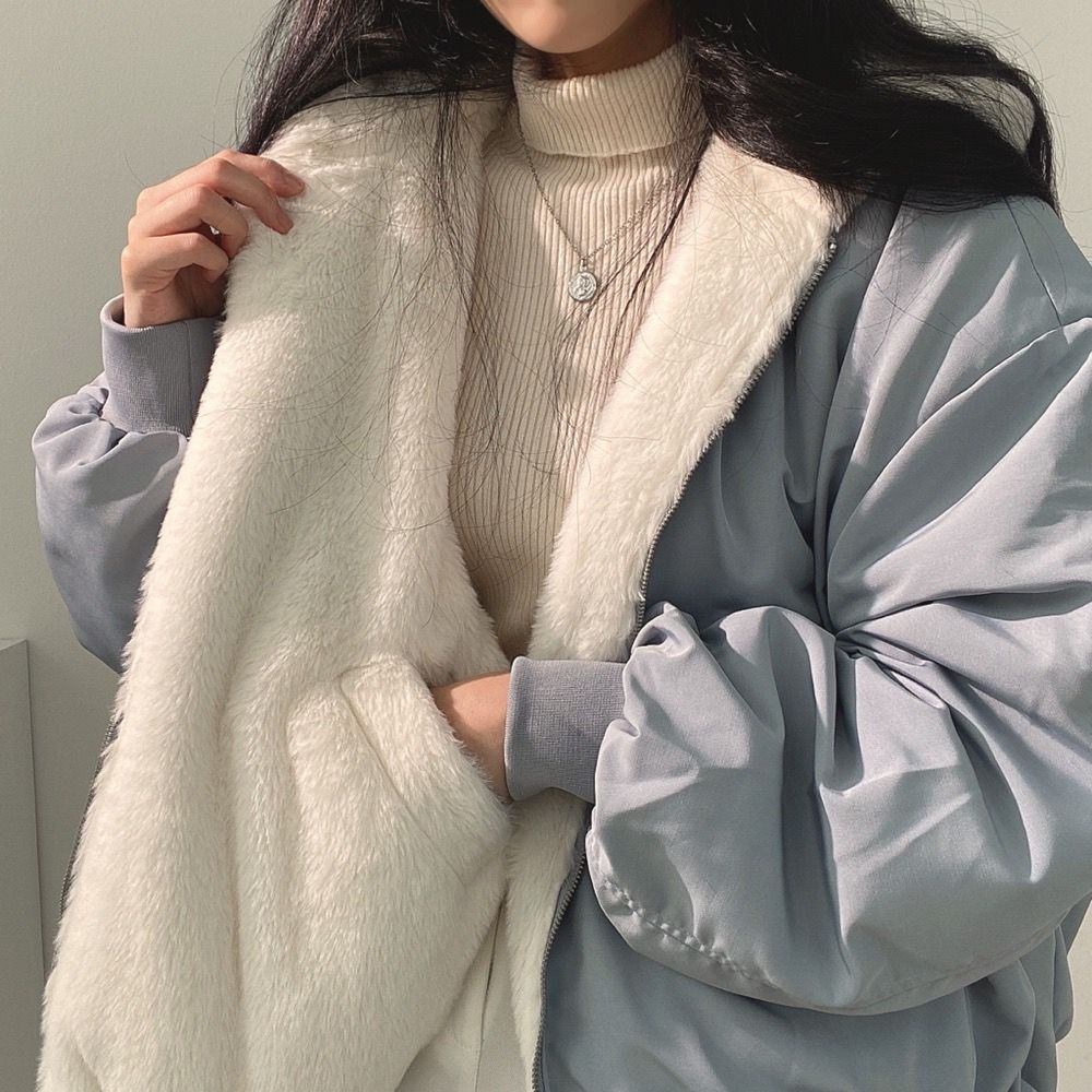 Women's Isla reversible winter jacket with hood, perfect for cold weather protection and style.