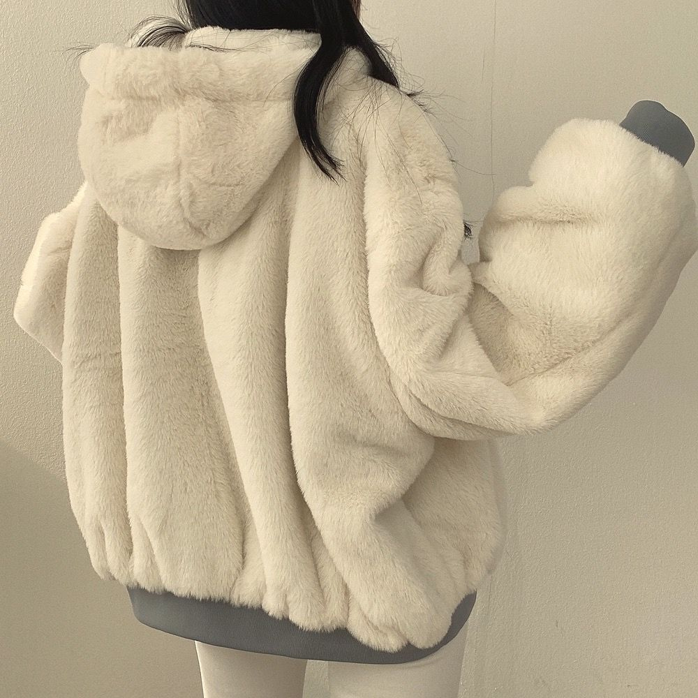 An elegant women's Isla reversible winter coat, perfect for staying warm and stylish in cold weather.