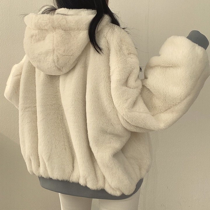 An elegant women's Isla reversible winter coat, perfect for staying warm and stylish in cold weather.