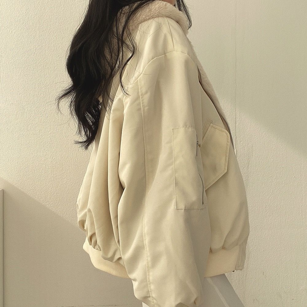 Women's Isla reversible puffer jacket with hood, offering warmth, comfort, and stylish outerwear.