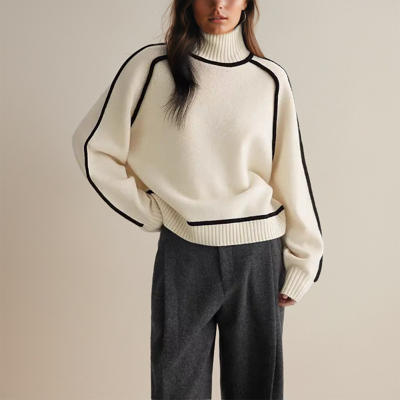 Soft knitted women's turtleneck jumper with elegant contrast trim. Cozy, relaxed fit for winter comfort.