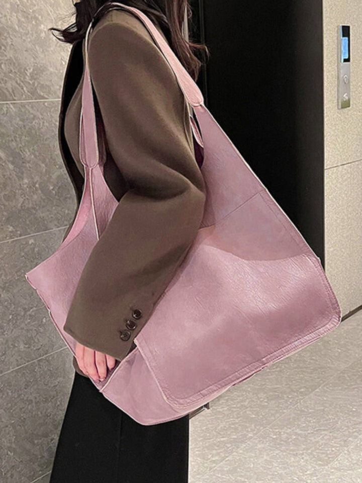 Chic women's large shoulder bag. Spacious travel tote, a must-have everyday handbag for modern women.