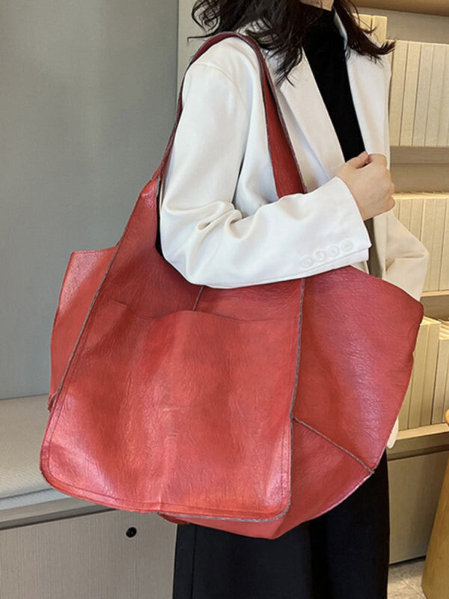 Stylish women's large tote bag with comfortable shoulder straps. Perfect for travel & everyday use.