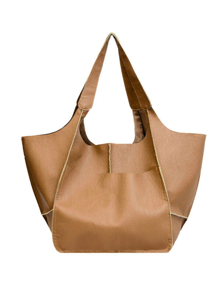 Elegant women's large shoulder tote bag. A stylish and practical handbag for travel and daily errands.