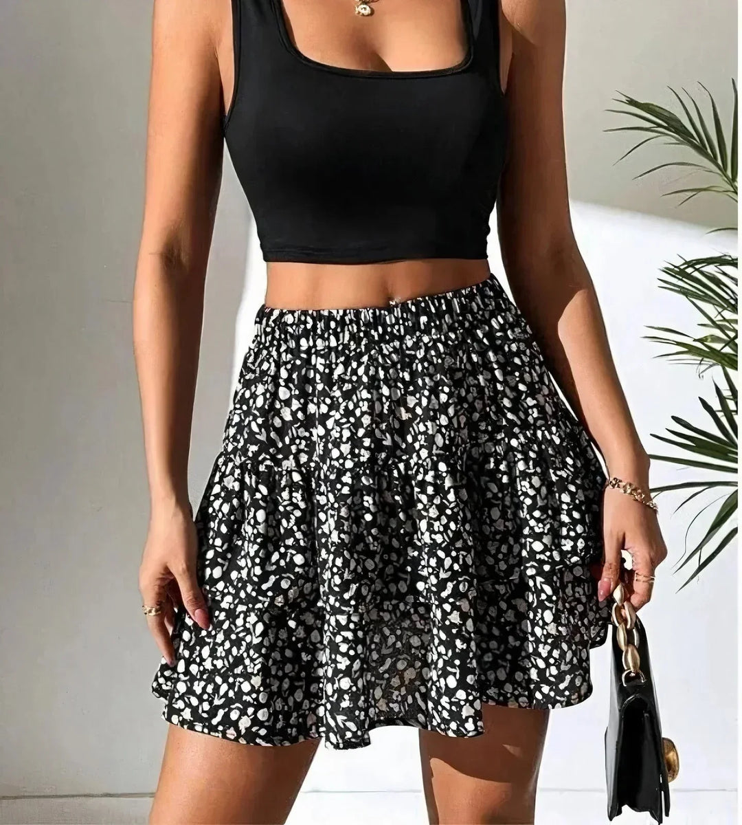 Trendy women's A-line mini skirt with playful layers, ideal for a chic summer fashion statement. Vacation-ready.