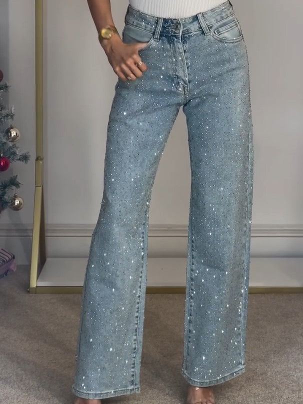 Women's light blue high waist straight leg jeans with sparkling diamanté embellishments.