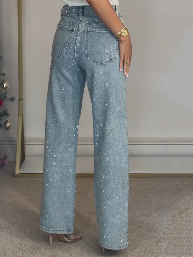 Stylish women's light blue straight leg jeans featuring a high waist and all-over sparkle.