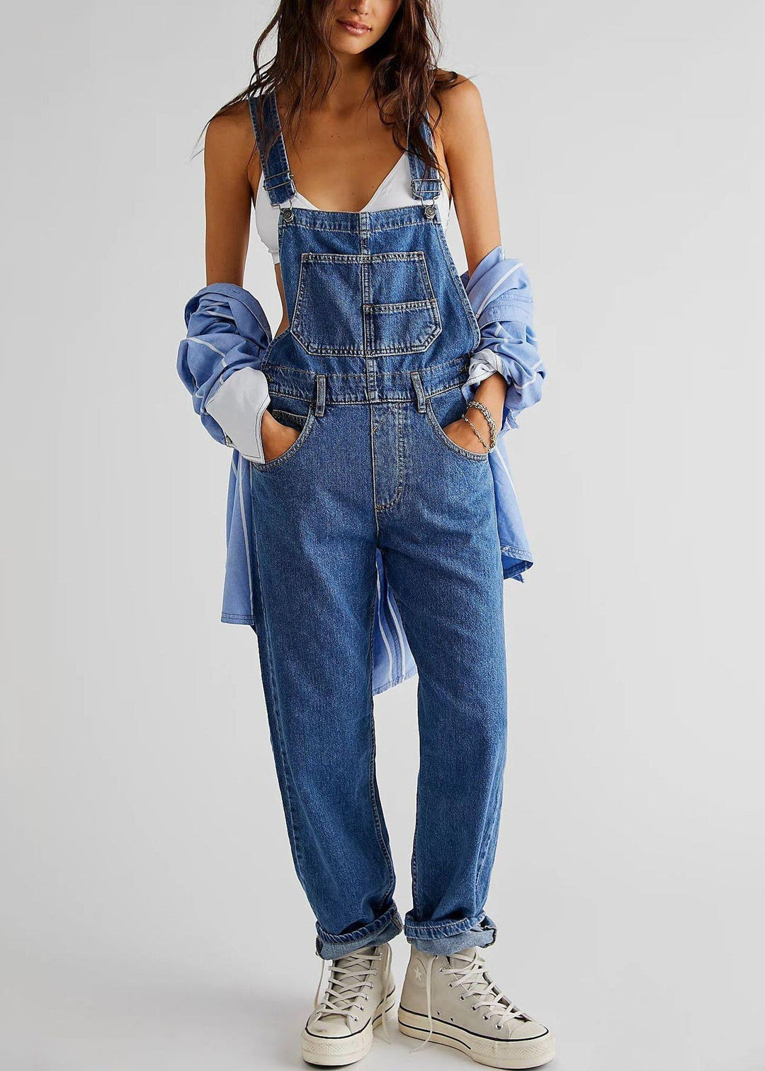 Women's light blue sleeveless straight leg denim jumpsuit for casual style.