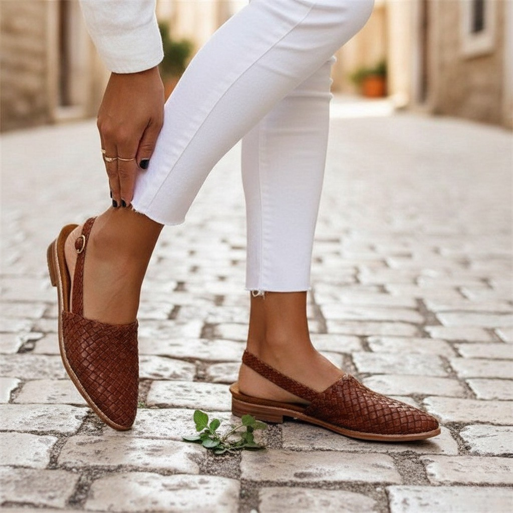 Stylish navy blue woven loafers for women, featuring a comfortable cushioned insole.