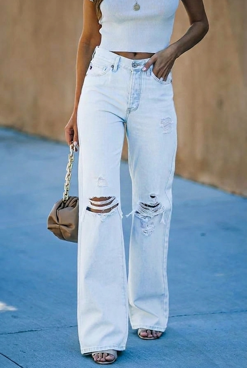 Effortless women's high-waist, wide leg jeans in light wash distressed denim for a trendy, relaxed fit.