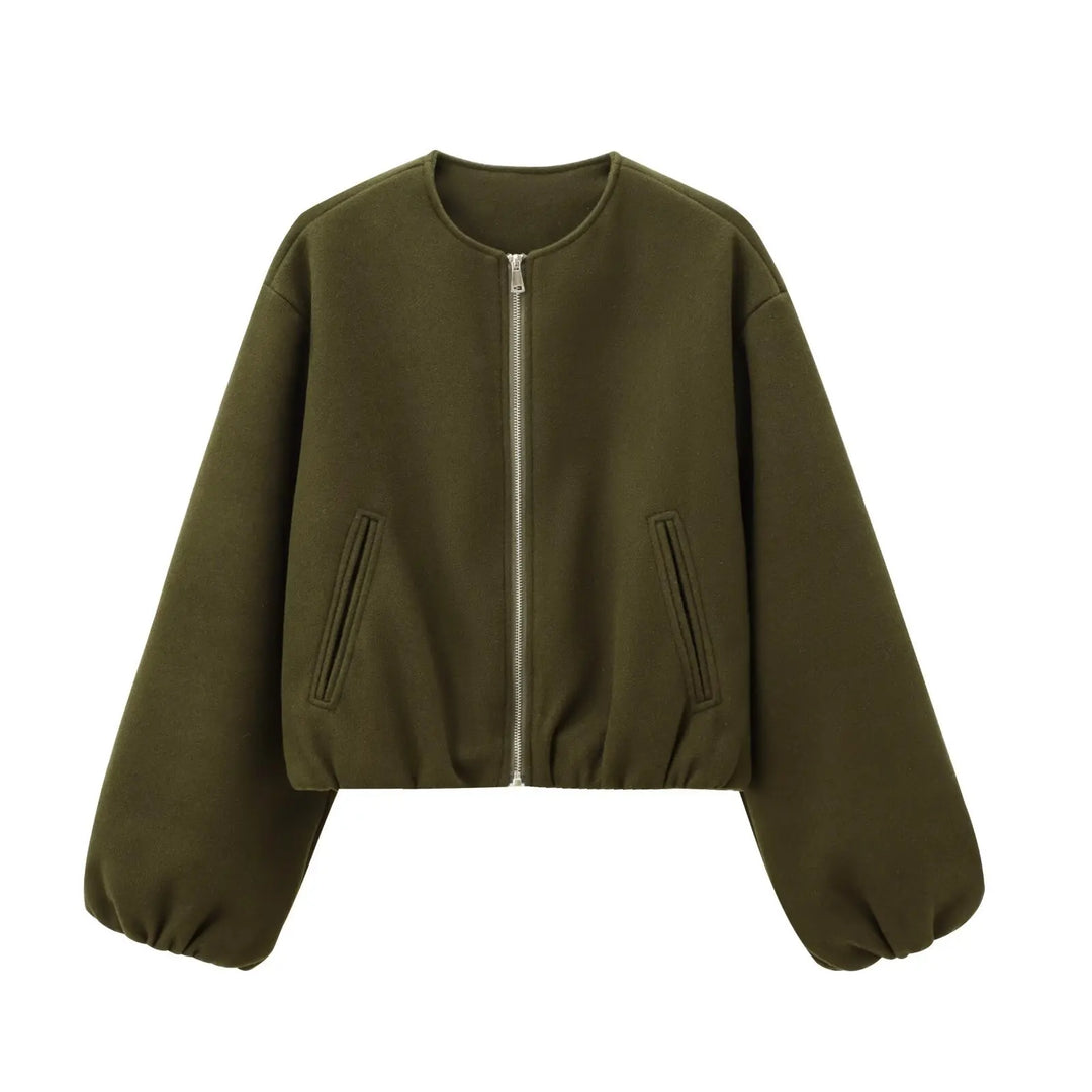 Close-up of the smooth, lightweight fabric of a women's bomber jacket, emphasizing comfort.