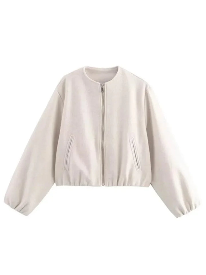 Model wearing a women's lightweight bomber jacket, showing comfortable fit & modern casual style.