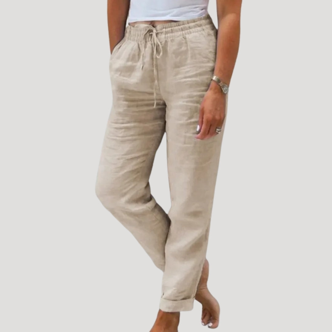Woman wearing comfortable, breathable women's linen trousers in a casual summer style. Lightweight pants.