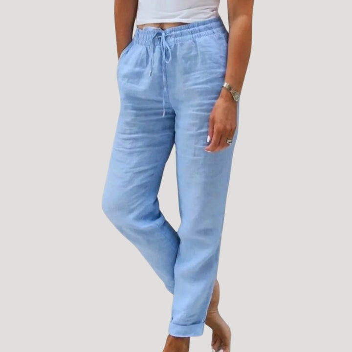 Folded women's casual linen trousers, highlighting lightweight design for summer vacation & comfort.