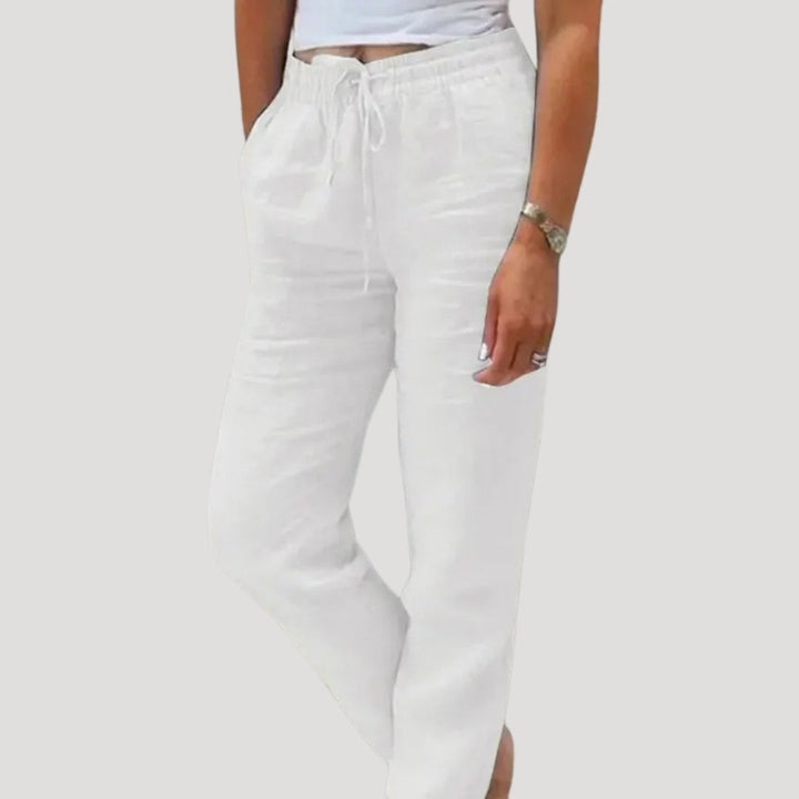 Back view of women's casual linen trousers, emphasizing relaxed fit & lightweight feel for summer comfort.