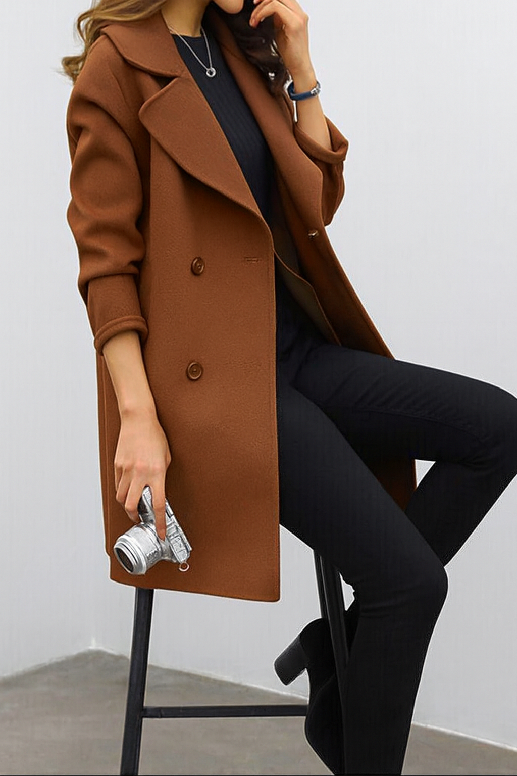 Stylish brown long trench coat for women with classic double-breasted lapel