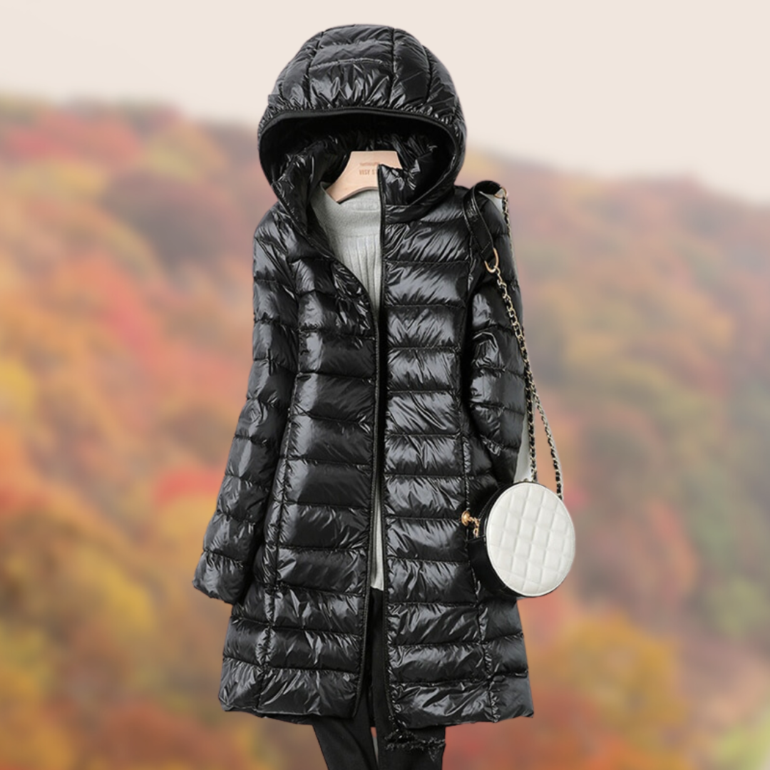 Cozy quilted puffer jacket for women with a full zip and warm hood.