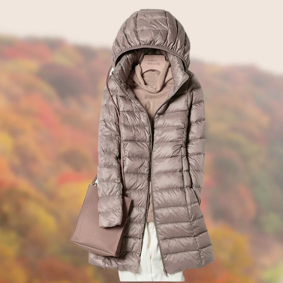 Stylish long winter coat for women, featuring a durable puffer design.