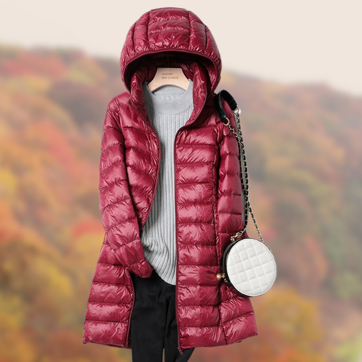 Essential women's winter jacket: a long, hooded puffer coat.