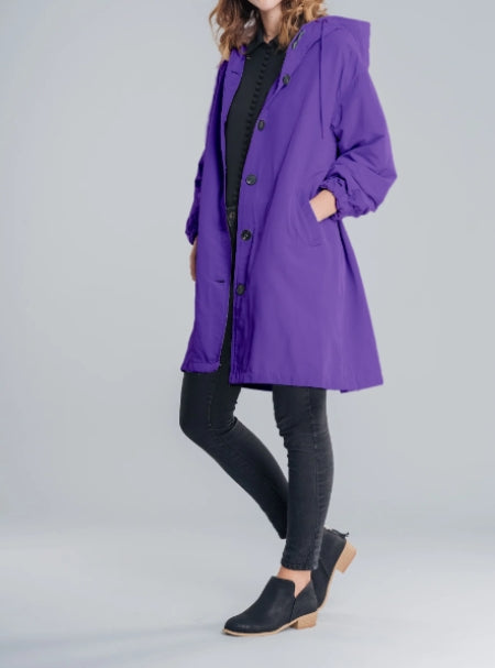 Back view of a women's waterproof hooded jacket, showing its long design.