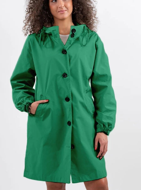 Model showcasing the stylish cut of a women's long rain jacket in green.