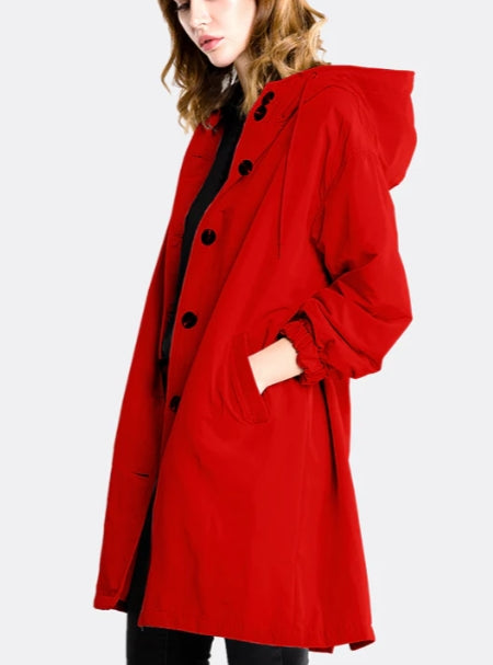 A women's long, waterproof jacket designed for comfort and style in bad weather.