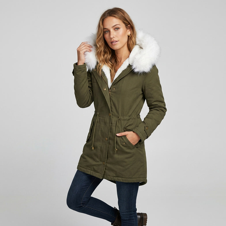 Elegant fur-trimmed hooded snow jacket for women, designed with a flattering belt