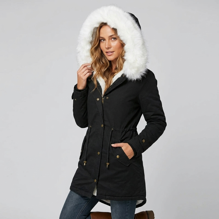 Elegant belted snow jacket for ladies, showcasing a faux fur trimmed hood