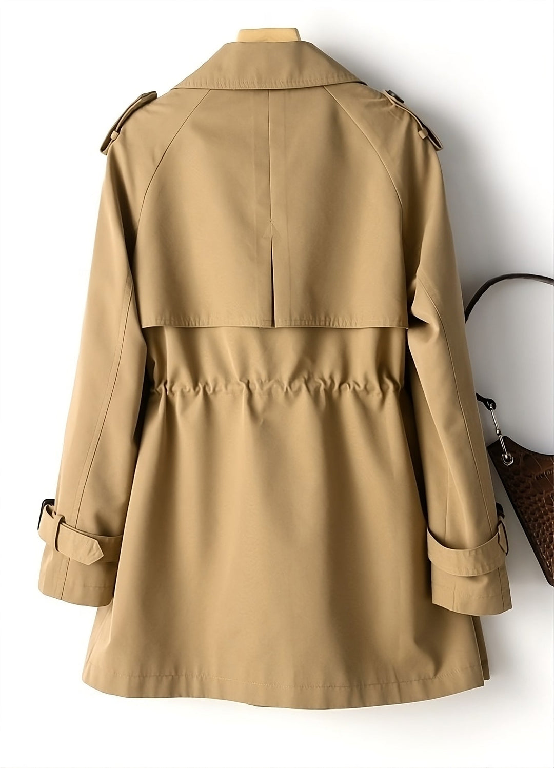 Close-up of the Long Marissa trench coat buttons and detail, showcasing elegant design.