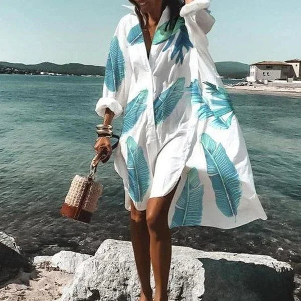 Stylish women's button-down beach cover-up with long sleeves, perfect resort wear for summer sun protection.