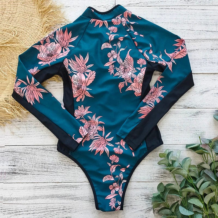 Athletic women's one-piece long sleeve swimwear, ideal for water sports, beach, and pool sun safety.