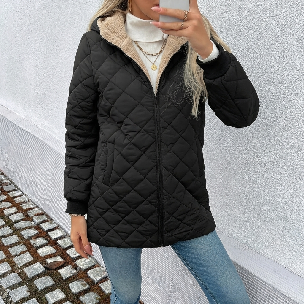 Elegant women's longline quilted coat with a hood & zip closure. A warm, fashionable winter jacket.