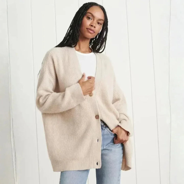 Relaxed fit women's oversized longline cardigan. Elegant button-front design for versatile fall & winter fashion.