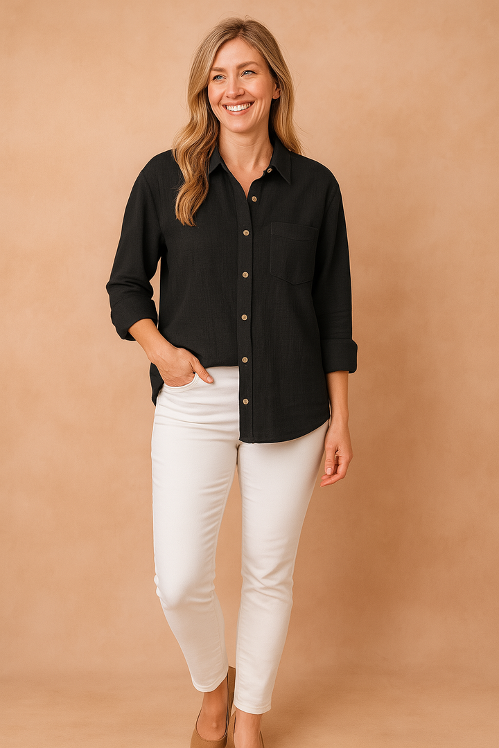 Fashionable women's long-sleeve loose-fit button-down shirt featuring a practical chest pocket for everyday wear.