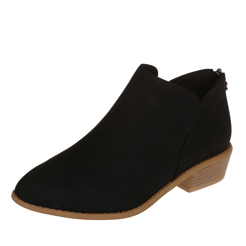 Close-up of women's slip-on work boots, showcasing durable material and subtle stitching.