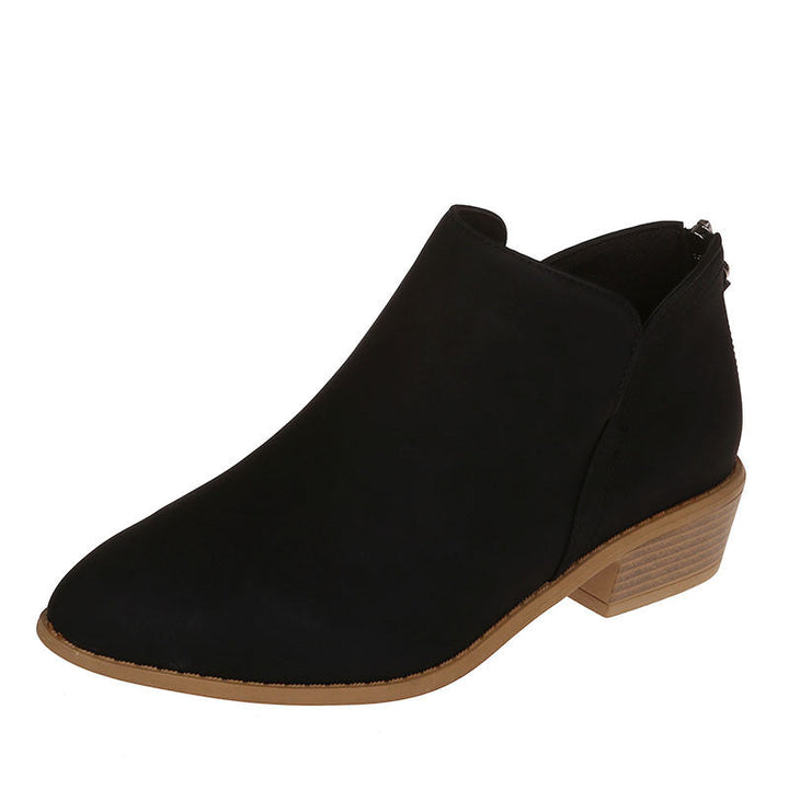 Close-up of women's slip-on work boots, showcasing durable material and subtle stitching.