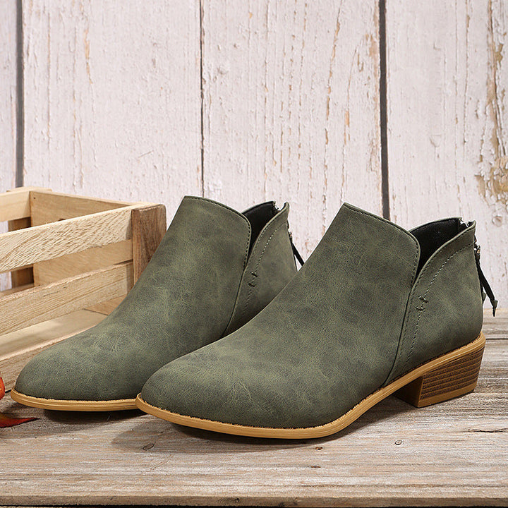 Versatile all-season women's work boots, featuring a convenient slip-on style and low heel.